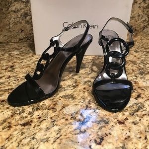 Calvin Klein black Kupid Patent sandals.