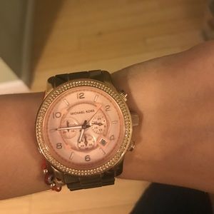 MICHAEL KORS oversized runway rose gold watch.