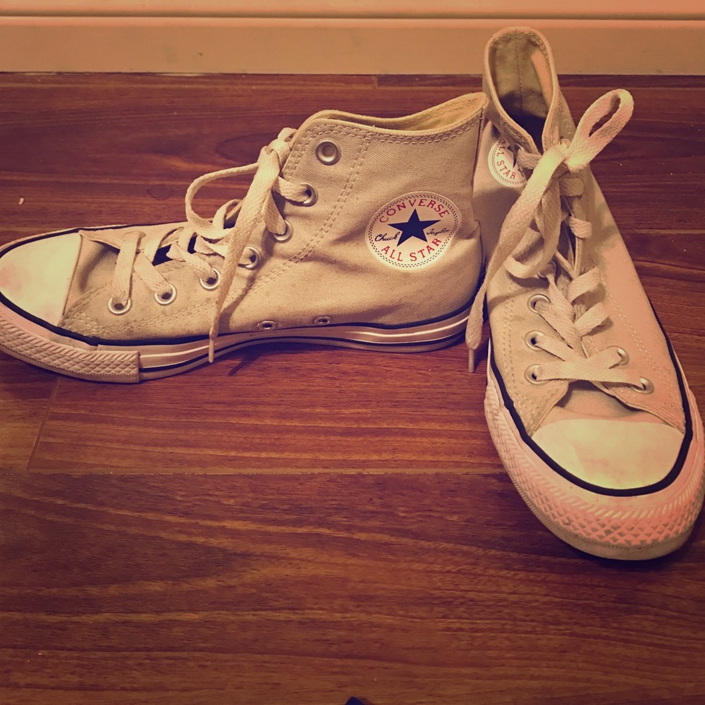 Tan high top Converse sneakers