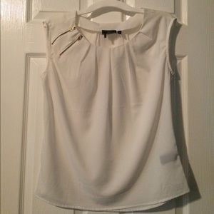 White blouse with zipper detail.