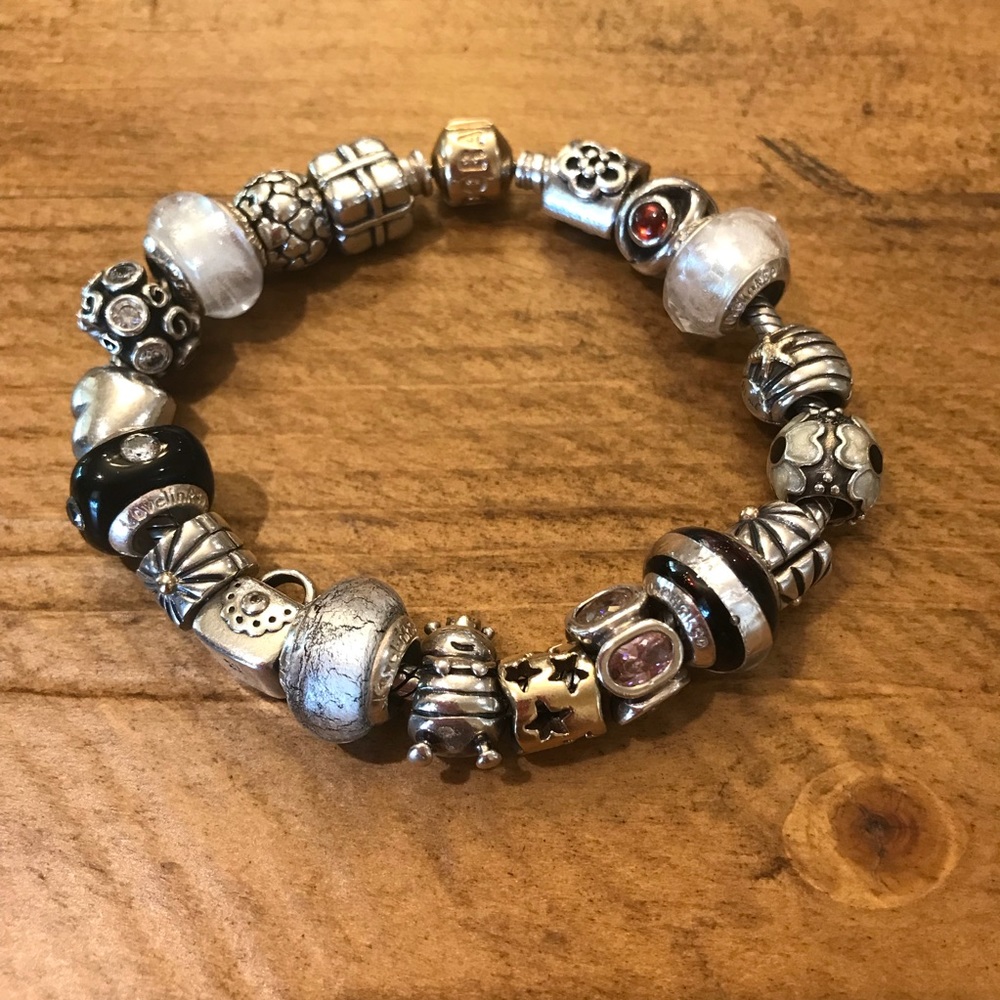 Gold clasp Pandora bracelet filled with beads!