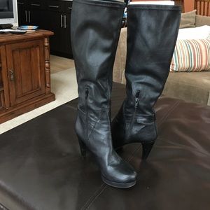 Black leather high heeled stretch boots