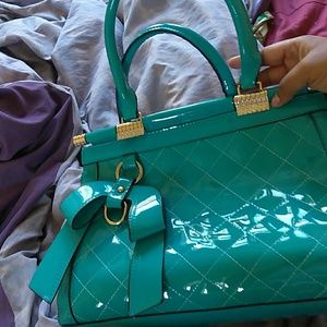 Its a blue leather purse