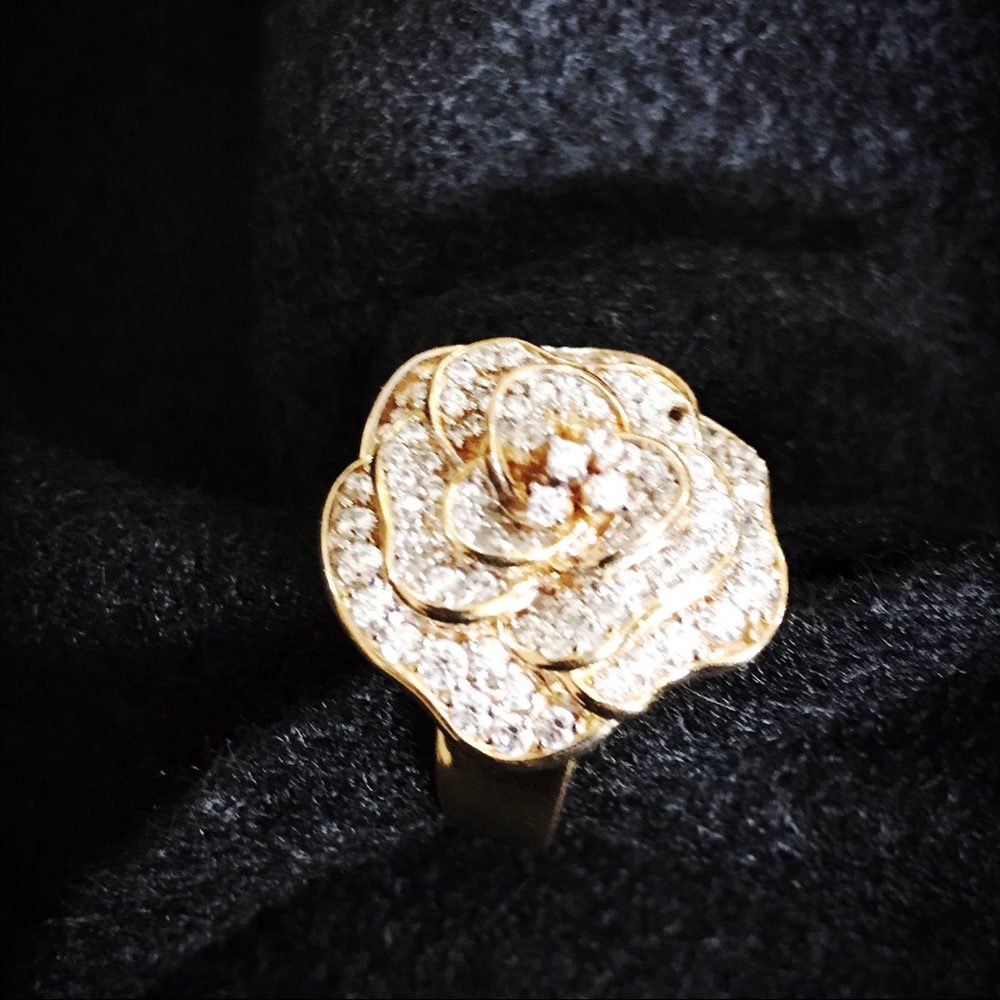 Gold tone cubic zirconia Technibond ring.
