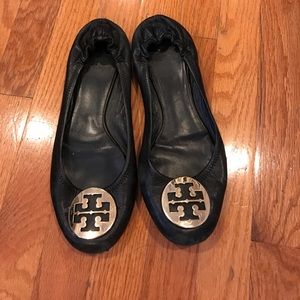 Tory Butch flats with gold symbol