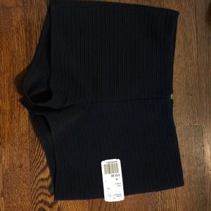 Blue shorts with golden zipper accent