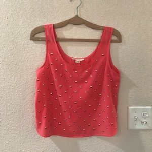 Coral embellished tank.