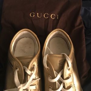 Gold Gucci sneakers