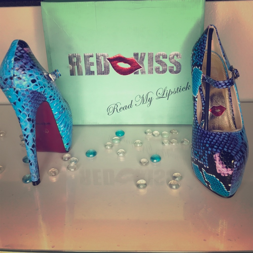 Blue snakeskin red bottom pumps