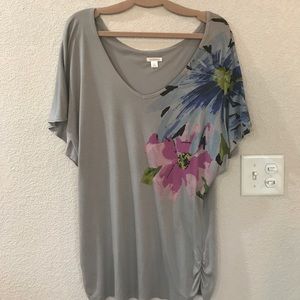 Oversized statement shirt with floral detailing.