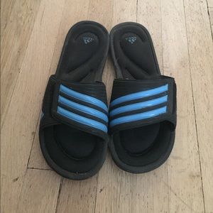 Blue and black adidas slides
