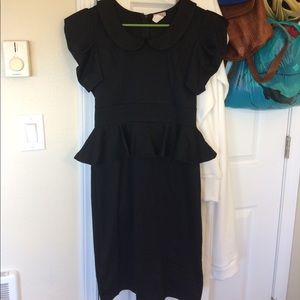 Black fitted dress with ruffled waist