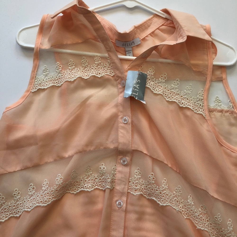 Delia’s flowy Top with tie on the bottom
