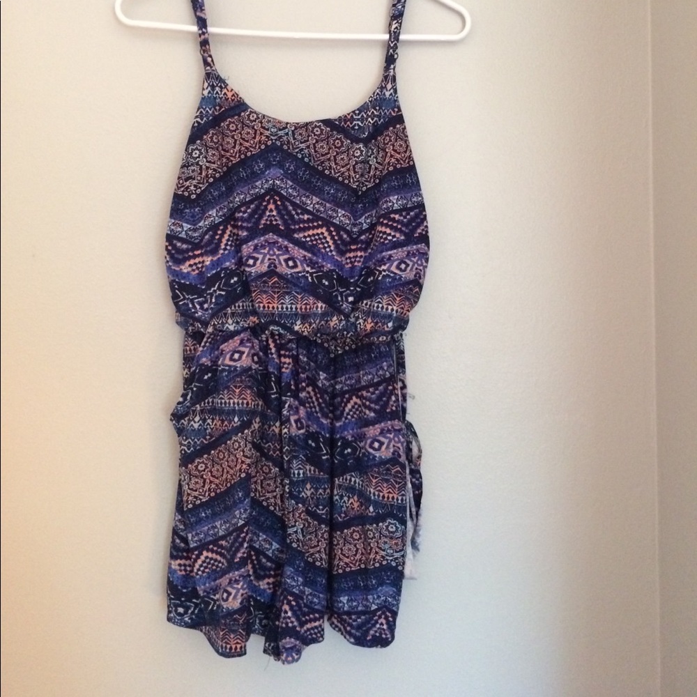 Purple, pink, and navy romper by Eye Candy