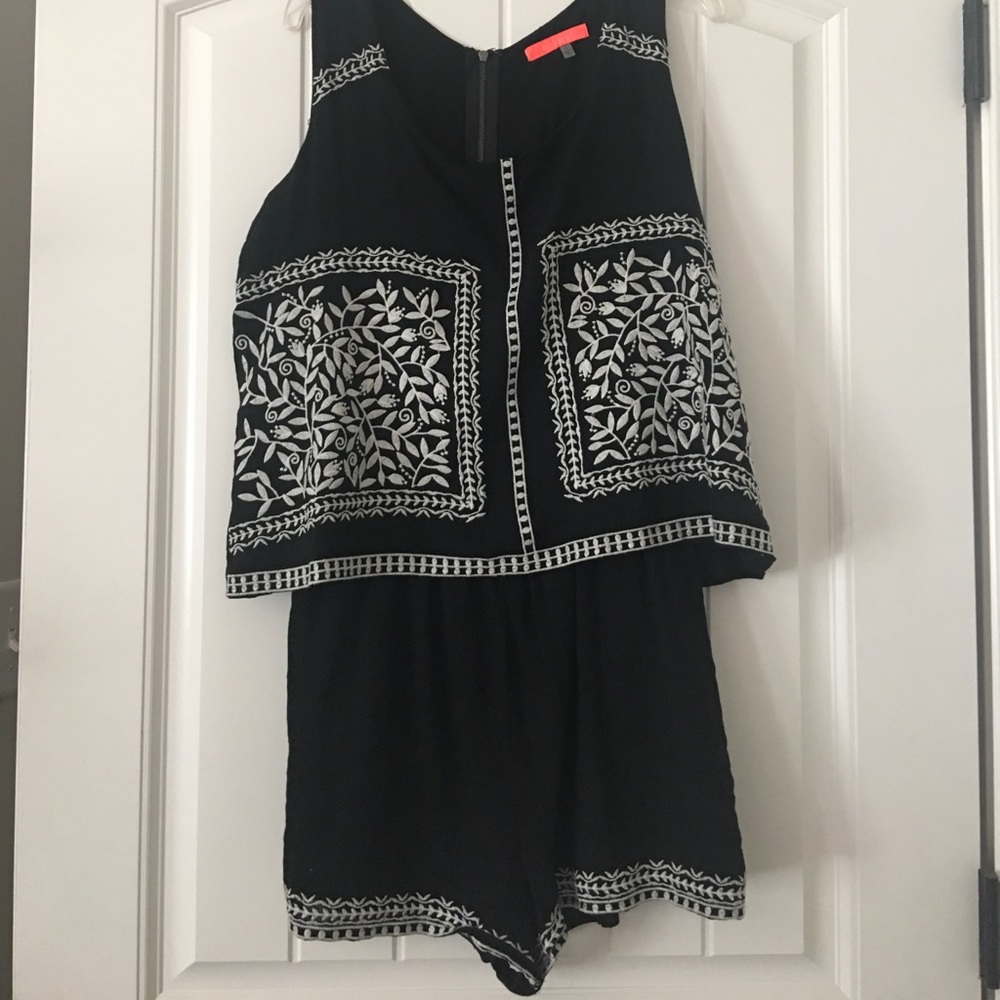 Black and white sleeveless romper