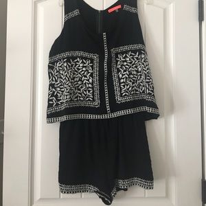 Black and white sleeveless romper