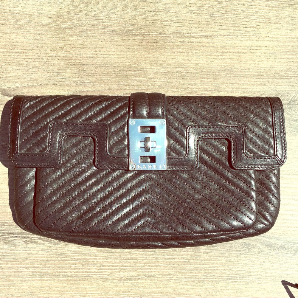 Quilted LAMB clutch with the lock latch