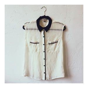 Transparent flowy sleeveless blouse.