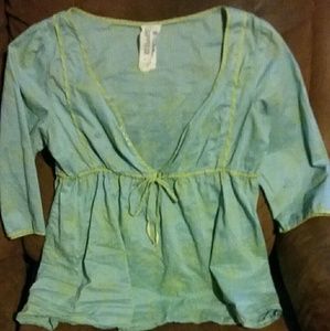 a baby doll peasent shirt