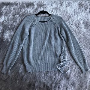 Knit sweater with lace up detail