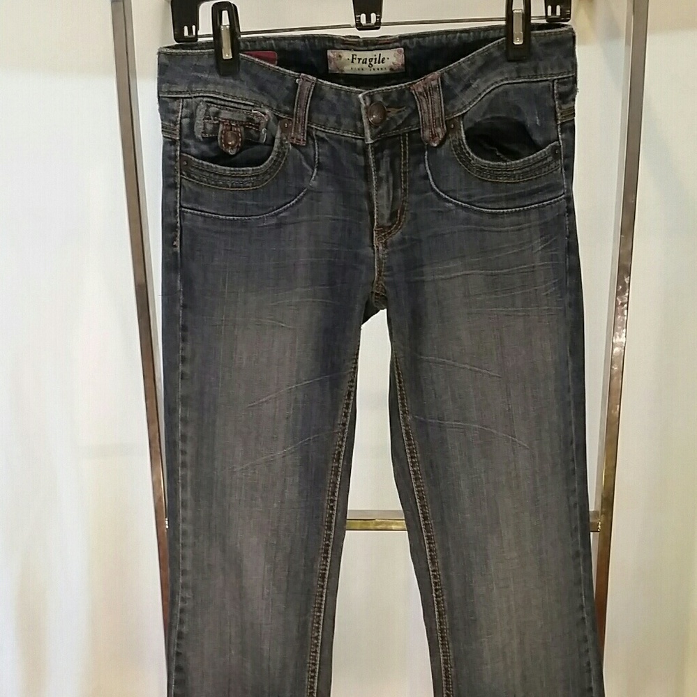 Fragile designer blue jeans
