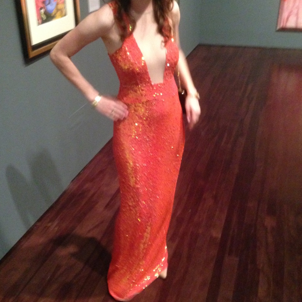 Formal black tie sequined gown in coral