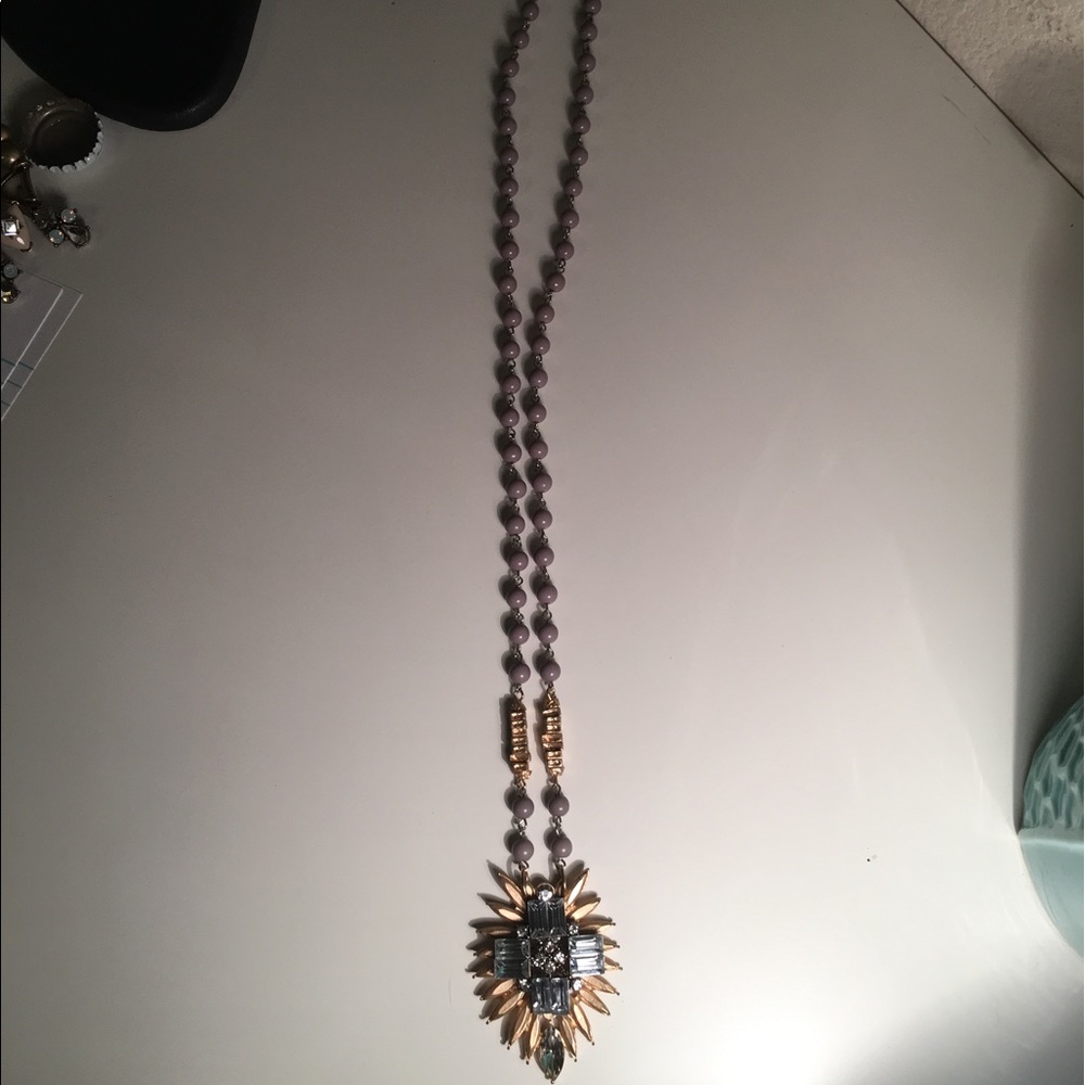 Very long, elegant necklace.