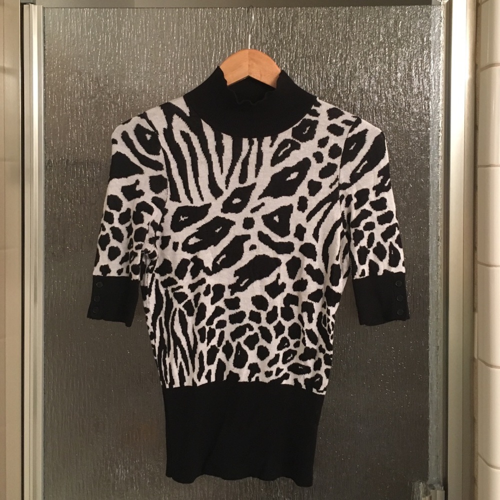 Playful animal print sweater. Size small