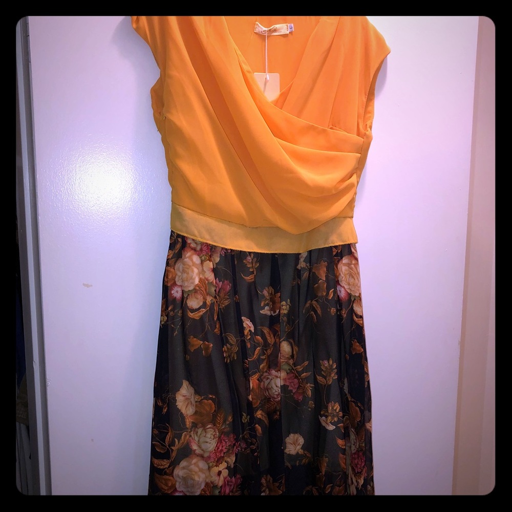 Cute gold and blue dress. Floral print on skirt