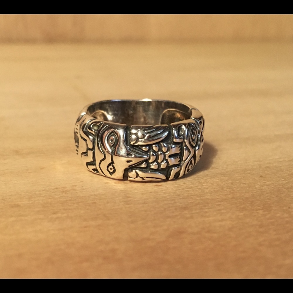 Silver ring with Native American totem pattern