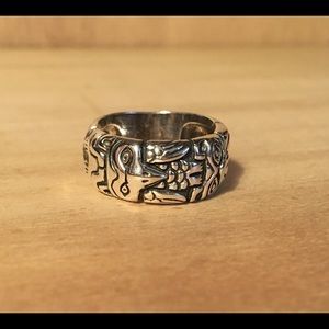 Silver ring with Native American totem pattern