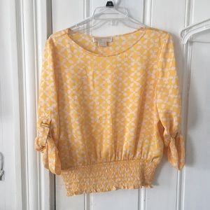 yellow michael kors blouse with white design