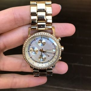 Gold DKNY watch with pearl face
