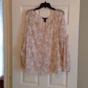 Geometric print blouse with dramatic sleeve