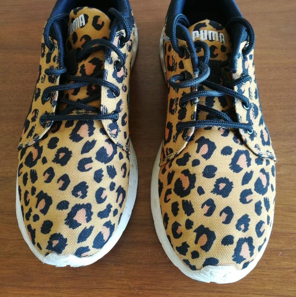 Leopard print Puma tennis shoes.