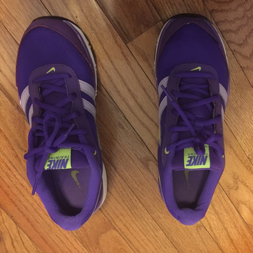 Nike running shoes in a deep and vibrant purple