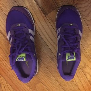 Nike running shoes in a deep and vibrant purple