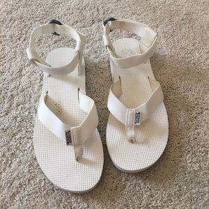 White teva originals. Little worn. Very loved.