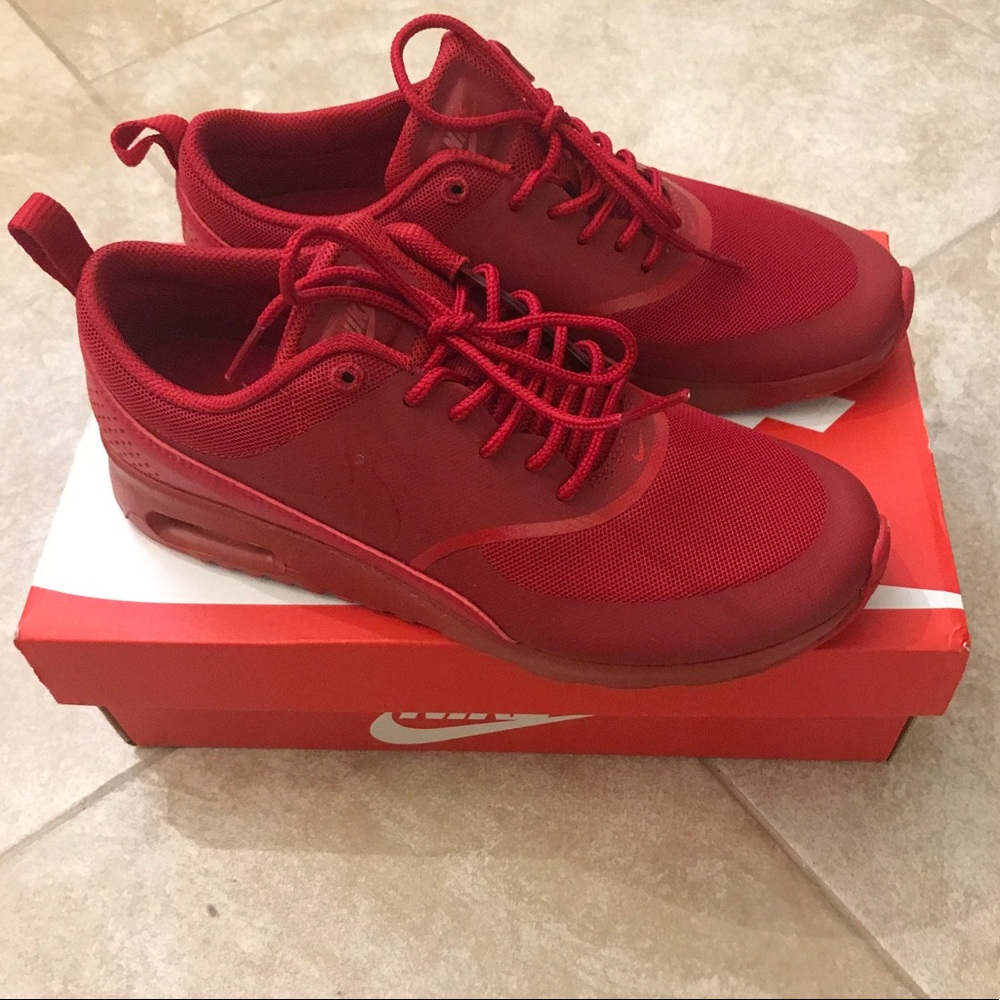 All red Nike Thea