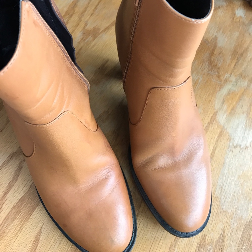 Markon brand zip ankle boots with 3 inch heel.