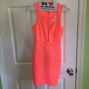 Neon orange bodycon dress.