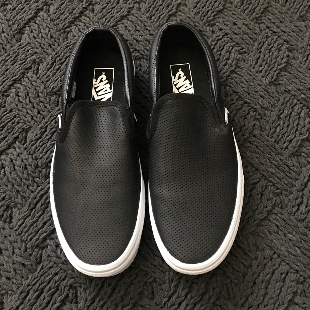 Vans black leather slip ons