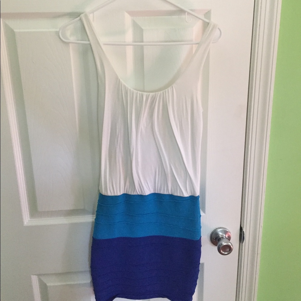 Dress is loose on top and fitting at bottom.