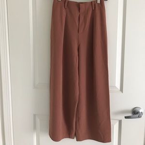 Women drape wide leg ankle length pants.