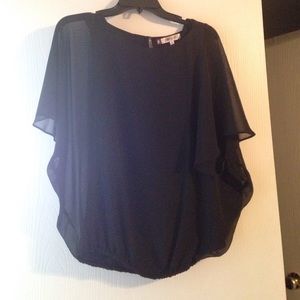 Black blouse by Jennifer Lopez.