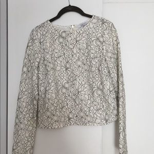 An incredibly chic,black and white,lace crop top.