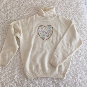 Ivory turtle neck sweater with pastel stones  