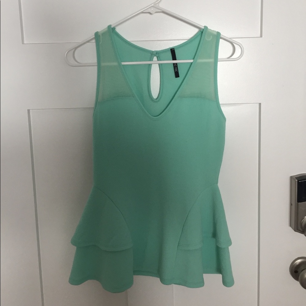 Peplum top with sheer detail
