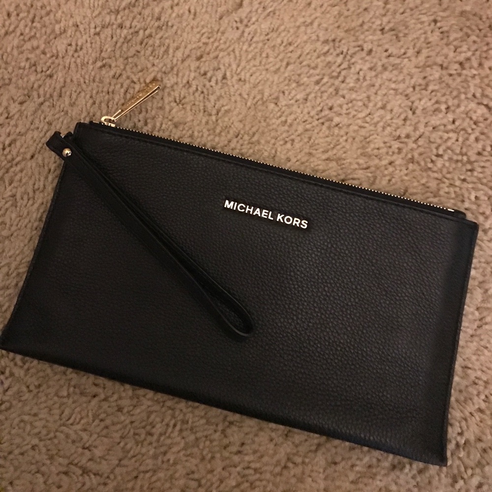Black MK wristlet, clutch.