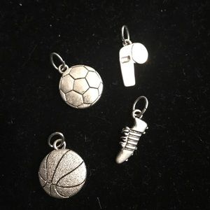 Set of 4 sports themed charms.